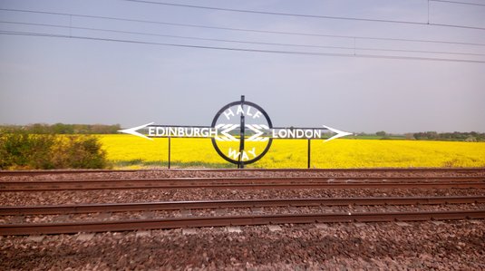 Sign marking Half Way point between Edinburgh and London on East Coast Main Line 
